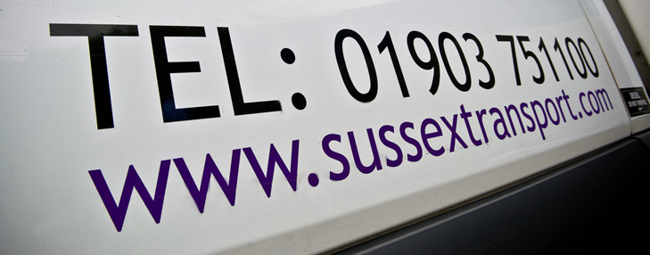 Sussex Transport Contact Details on the side of one of our fleet