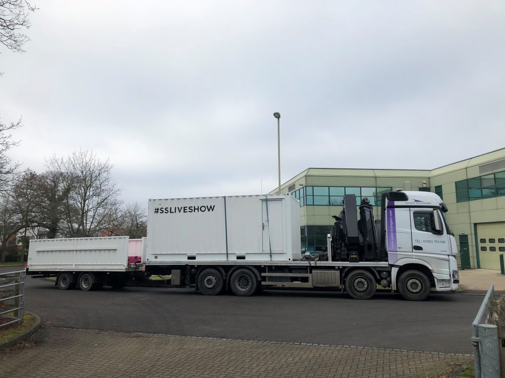 One of Sussex Transport's HIAB and drawbar trailers outside the 'Pro Hair Live' show in Manchester.