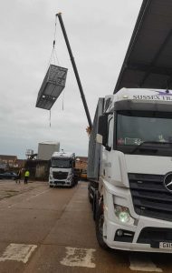 monocoque shell being lifted into place by Sussex Transport